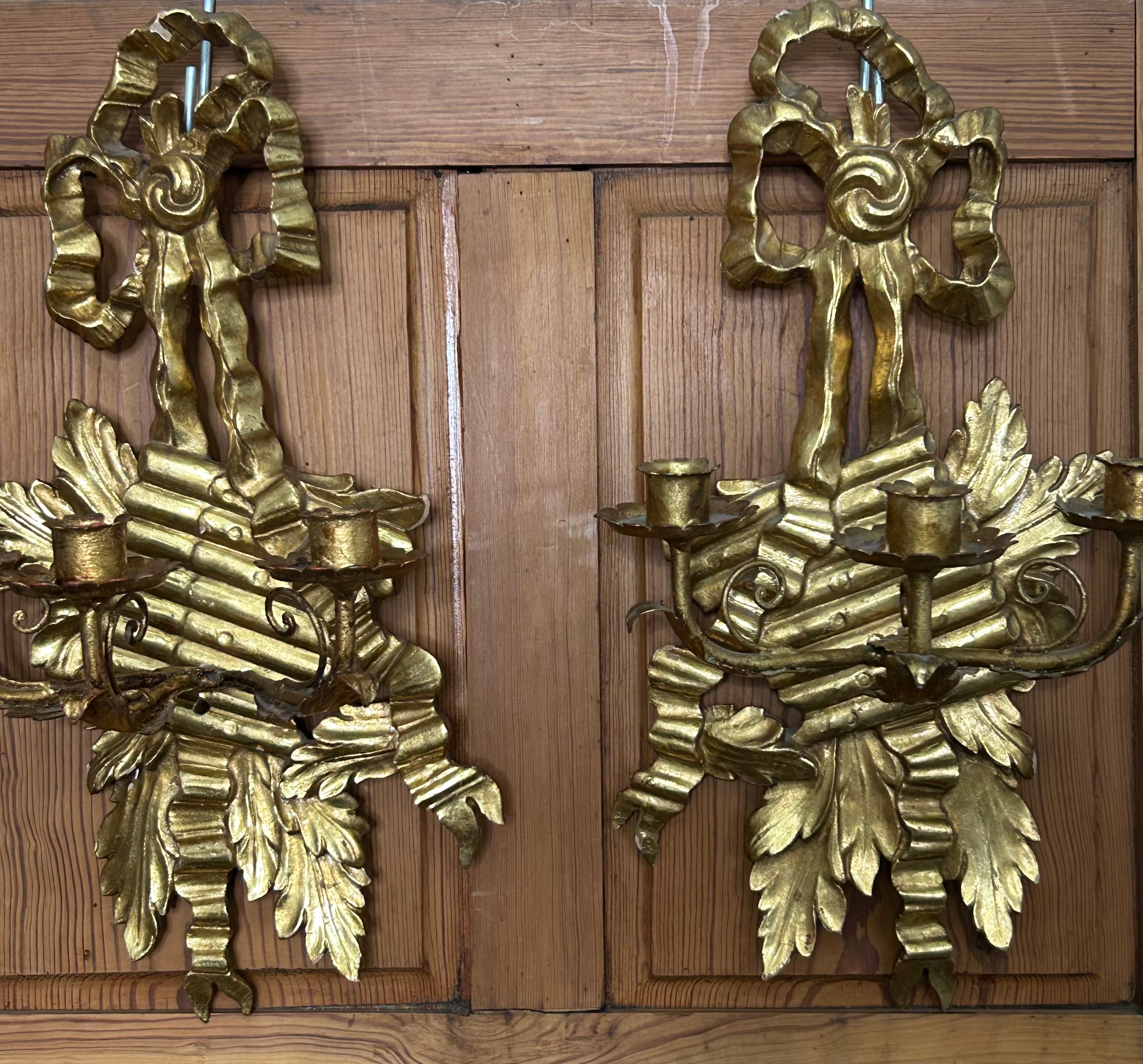Stunning pair of Gilt Wood Three arm Wall Sconces
